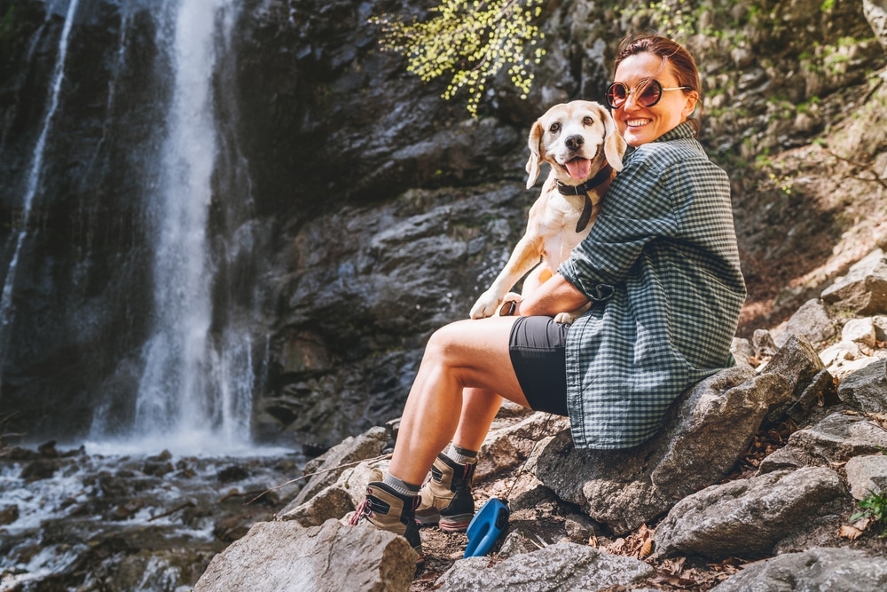 Visit Governor Dodge State Park This Summer 13 Woman enjoying waterfalls, like those at Governor Dodge State Park, with her dog
