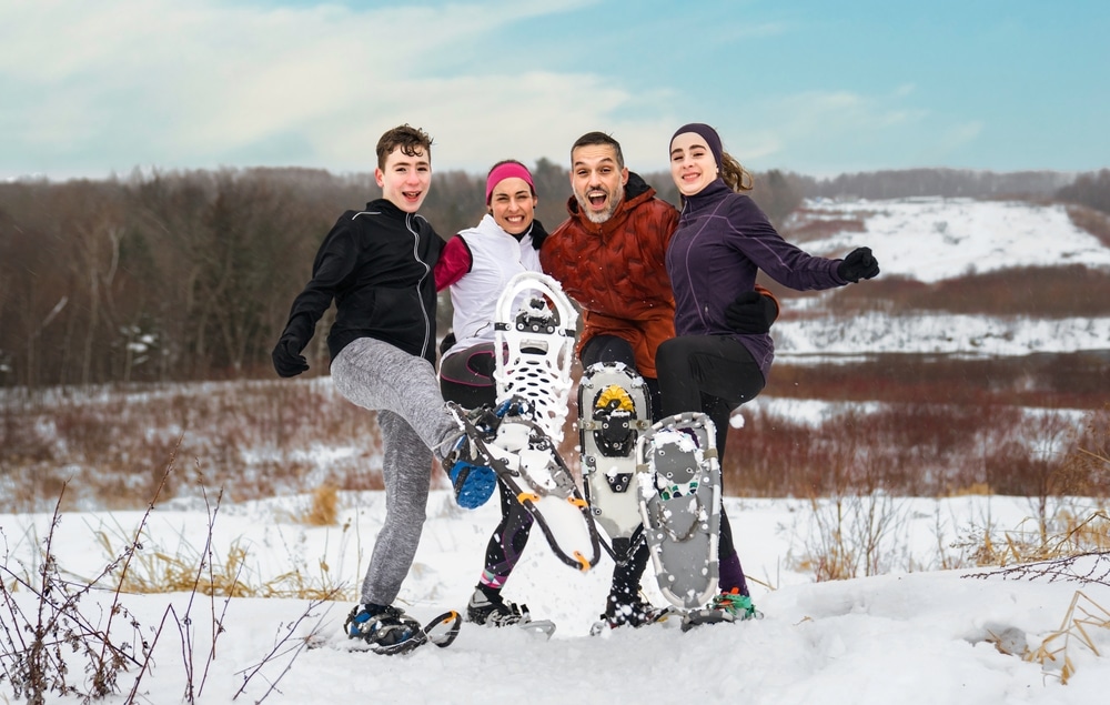 Family enjoying snowshoeing, one of the best things to do in Wisconsin in winter