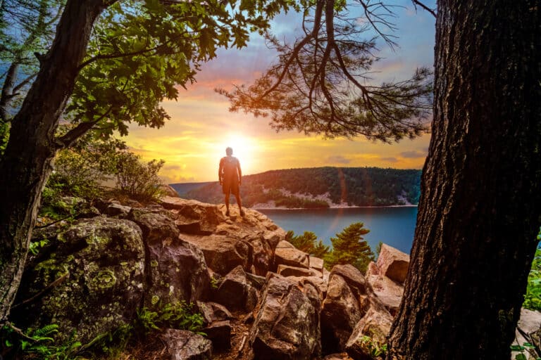 man hiking at Devil's Lake State Park - one of the best things to do in Wisconsin