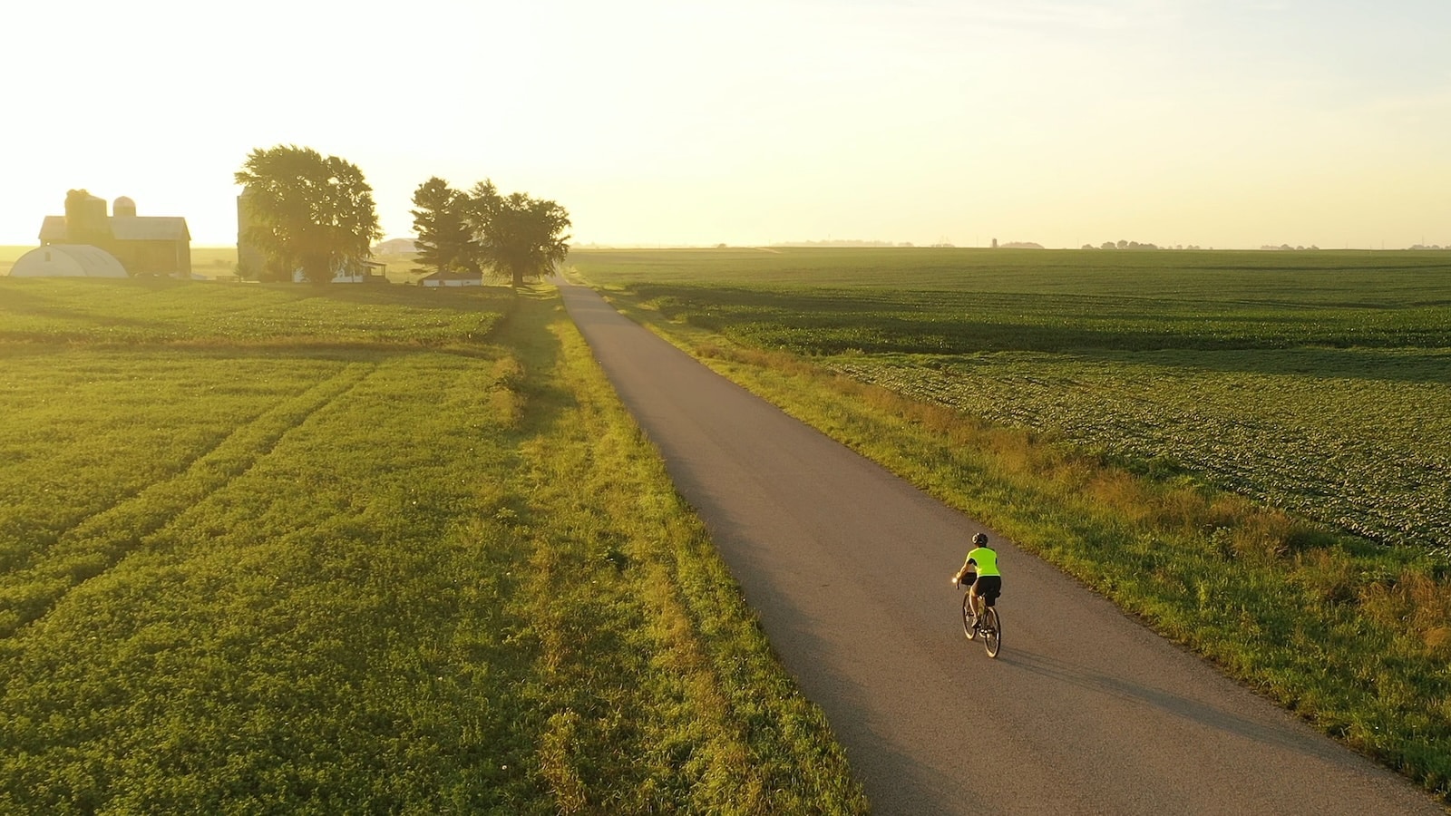Cyclist is riding american countryside, one of the best things to do in Wisconsin