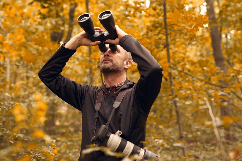 Man enjoying fall birdwatching on the Great River Road