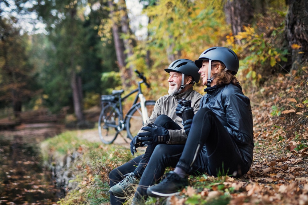 Couple out enjoying biking in the Midwest this fall, while enjoying the best places to stay in the Midwest