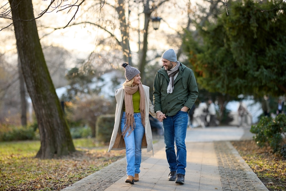 Couple walking hand in hand during romantic getaways in Illinois