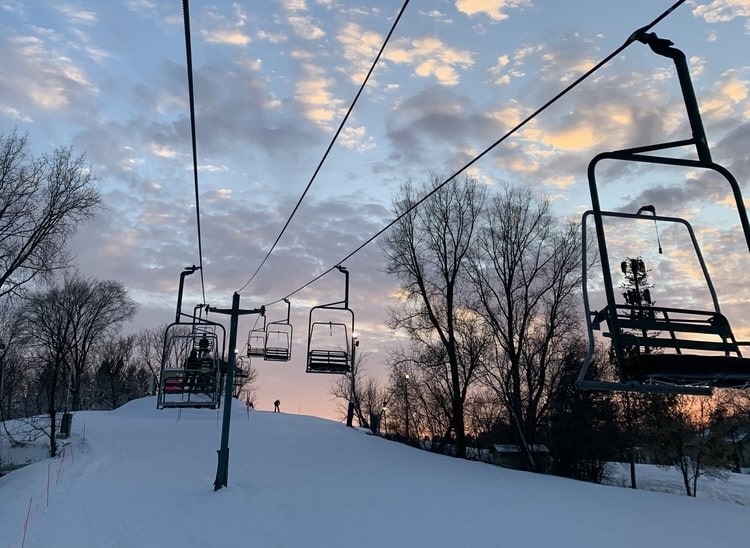 Ski lift with gorgeous ski at one of the best Midwest ski resorts