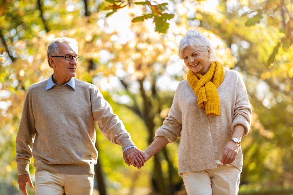 senior couple enjoying a walk during one of the best Midwest weekend getaways during fall foliage