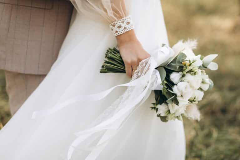Couple holding a bouquet at outdoor unique wedding venues in the midwest