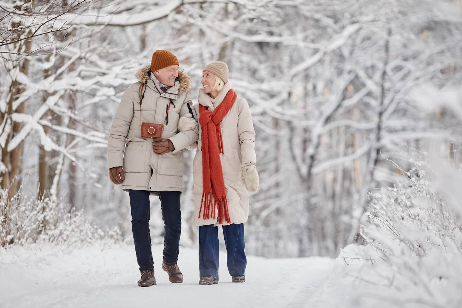 Senior couple enjoying a frozen walk during their getaways this winter in Minnesota