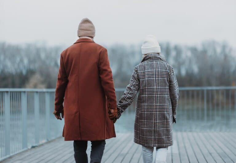 Senior couple walking in the winter and enjoying time together during their Valentine's Weekend getaways in the Midwest