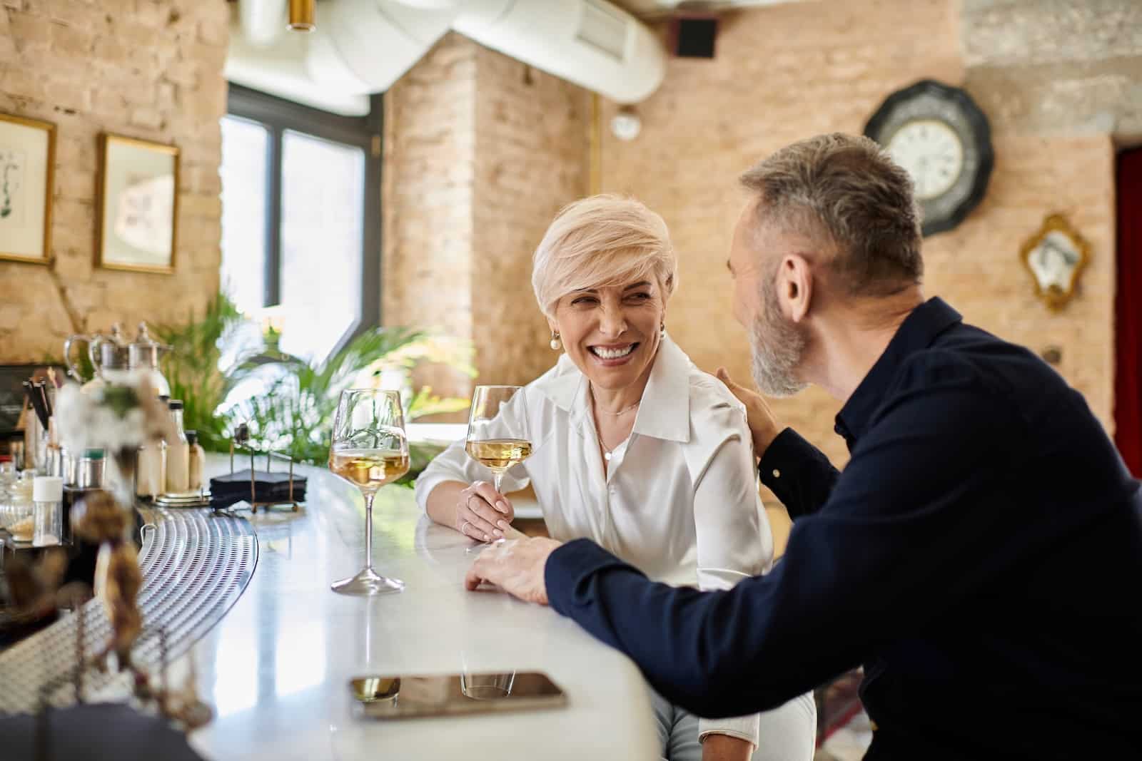 Couple enjoying a wine tasting during their romantic getaways in Wisconsin