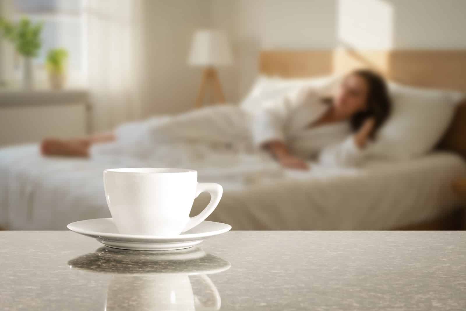 Woman relaxing in bed during her romantic weekend getaways in the Midwest