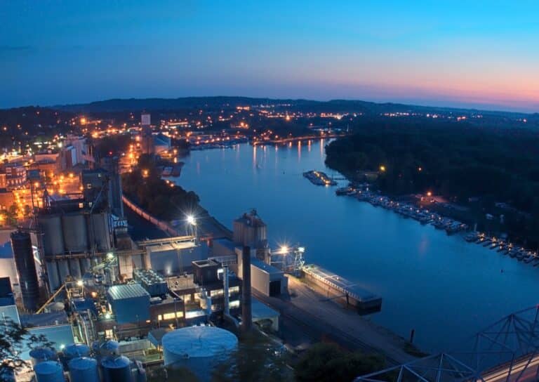 Downtown Red Wing MN Minnesota with sunset - industrial site and bridge to Wisconsin in foreground